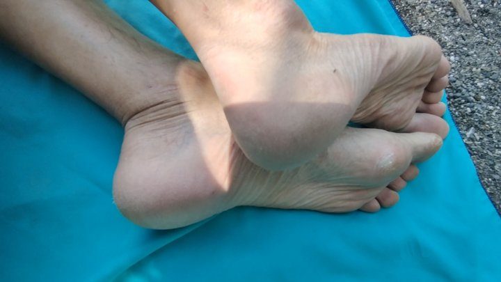 Salvatrix Crucifix - Worn feet, heels, toes and soles, naked on a public beach