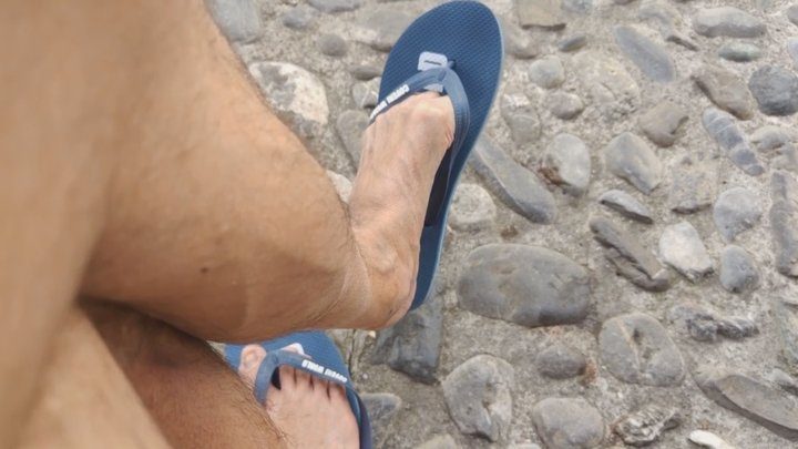 Salvatrix Crucifix - Dangling flip flops on a public bench