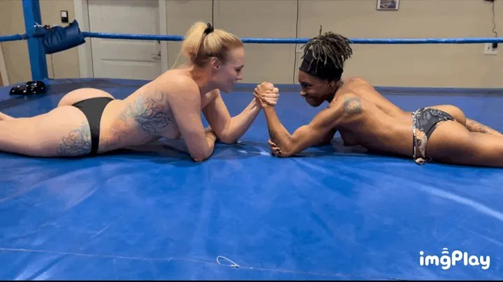 Protein Wrestling - Part 1 Jolene Hexx vs Kirra Blaze in a topless competitive arm wrestling match