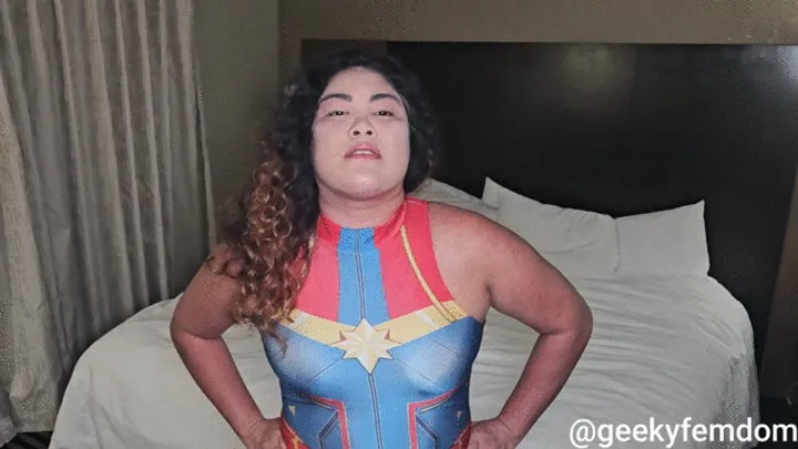 Geeky Femdom - Captain Marvel dominates a wimp (played by Kim Chi)