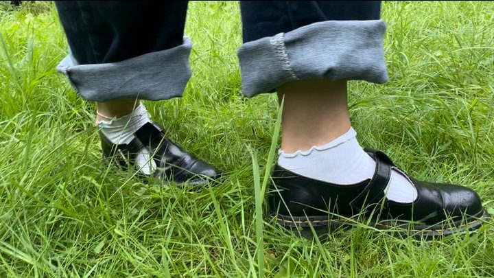Amelie And Anthony - Naughty Amellie gets her feet and socks dirty while walking on the grass
