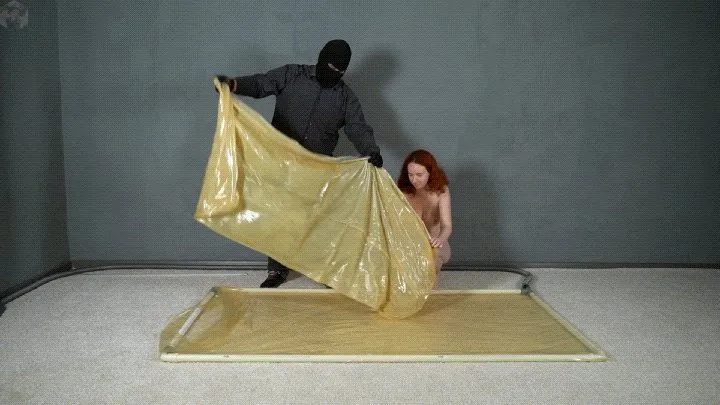 Vacuum Dreams - Transparent latex vacuum bag in a transparent vacuum bed