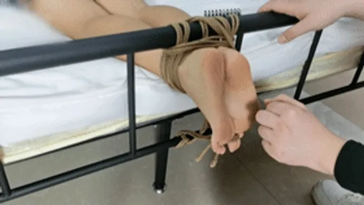 Chinese Bondage Foot Fetish - xy243-Chinese girl's bare feet are tied with ropes at the end of the bed to tickle her feet