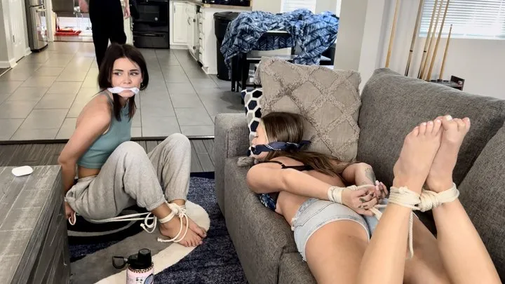 Tied Tales - Rescue Us HD-Laney is bound and gagged by burglar Devyn while Peyton listens to music on her headphones