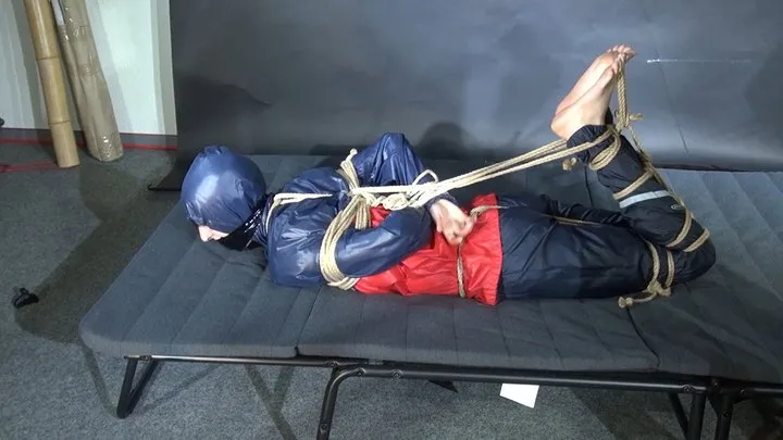 Shinynylonartsbound - Myxxxy bound and gagged in shiny nylon Rainwear trying to free herself