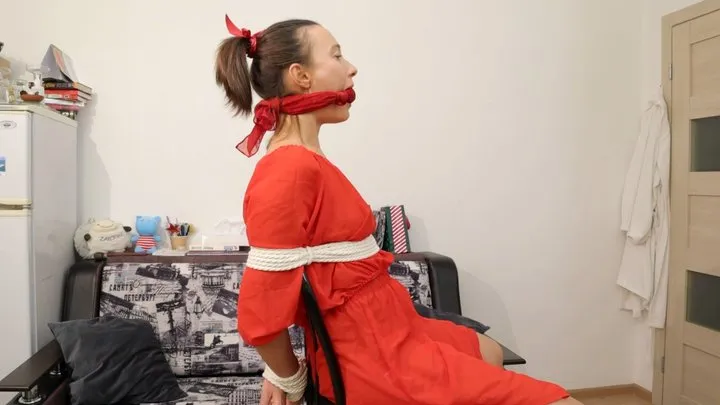 Bondage Dreams - Sofi in a red dress tied to a chair with a black rope_Part 3
