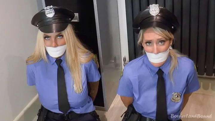 Borderland Bound - Rachel-Lei & Emma in: StakeOut TakeOut!! Hot Demoted Cop Cuties Secured with Their Own Cuffs & All Gagged Up in the Sales Kiosk! (Extra Fun Cut)
