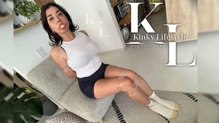 Kinkylifestyle - Simona Fell on a Sponge (Sponge Gag, Clear Tape Bondage, Socks, Shorts, TankTop, Struggling, Hopping, Escaping)
