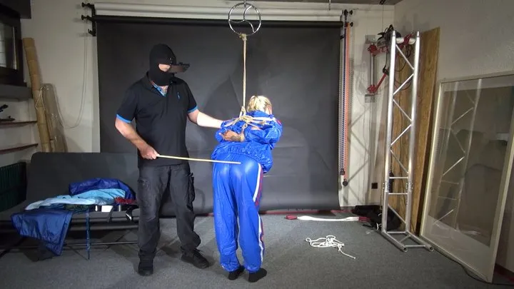 Shinynylonartsbound - Ms Ungeniert bound, gagged and spanked in a shiny PVC Saunasuit