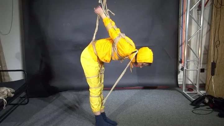 Shinynylonartsbound - Marie tied and gagged in shiny nylon Rainwear