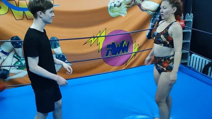 The Wrestling Amazons - Fit redhaired girl dominates a young guy in the ring