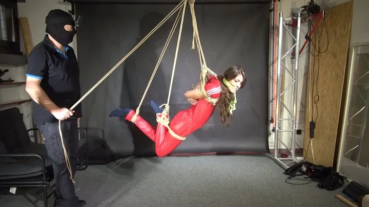Shinynylonartsbound - Marie tied gagged and suspended in a shiny nylon Jumpsuit