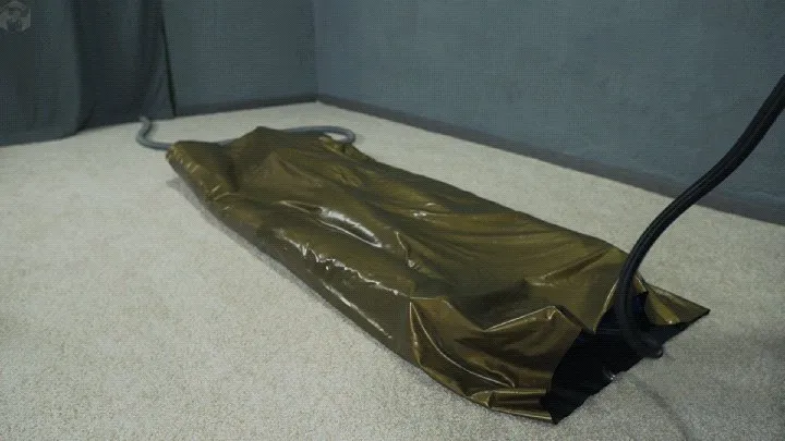 Vacuum Dreams - Sonya in a gold vacuum bed on a vibro mattress