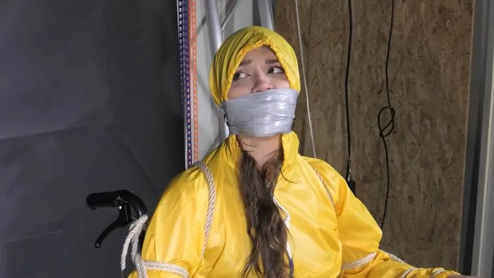 Shinynylonartsbound - Watch Marie bound to a Wheelchair and tightly gagged in shiny nylon Rainwear