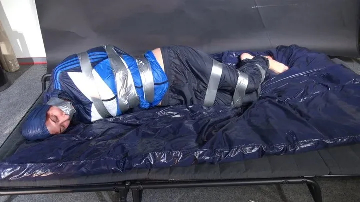 Shinynylonartsbound - Myxxxy bound and gagged in shiny nylon blue Rainwear trying to free herself