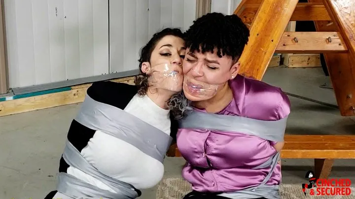 Cinched And Secured - Jayda & Simone - Taped, Gagged, Packed and Trapped (WMV FORMAT)