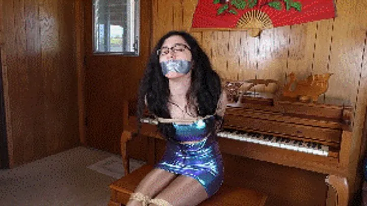 Hollyrope Omega - Khrystal the famous pianist, wearing a cosmic dress, tied and gagged by a jealous pianist who wants to ruin her career!