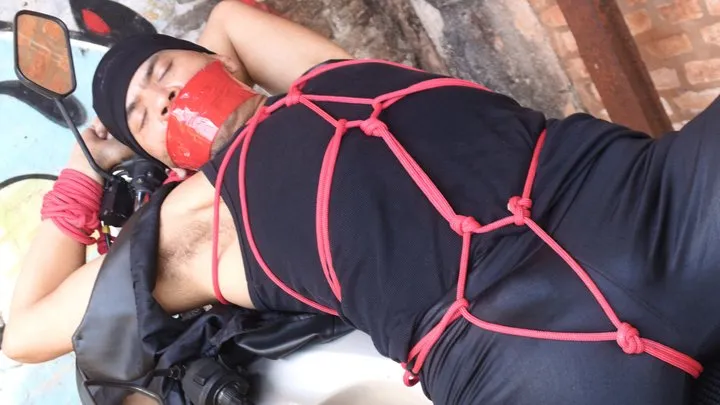 Brazilian Bondage Boys - Biker tied to his motorcycle (Set 1)