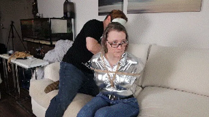 Hollyrope Omega - Summer tightly wraparound tape gagged, tightly tied up with plastic cuffs and ropes, during a robbery!