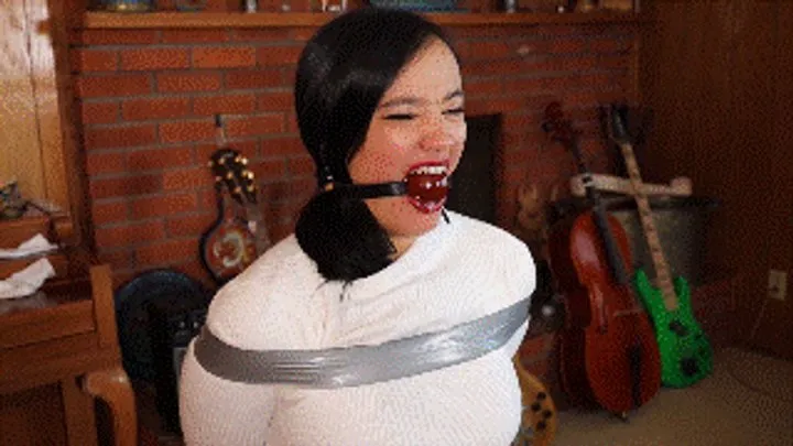 Hollyrope Omega - Raven Lynette tied during an undercover mission, first gagged with ballgag then mouth heavily stuffed and wraparound gagged with clear tape