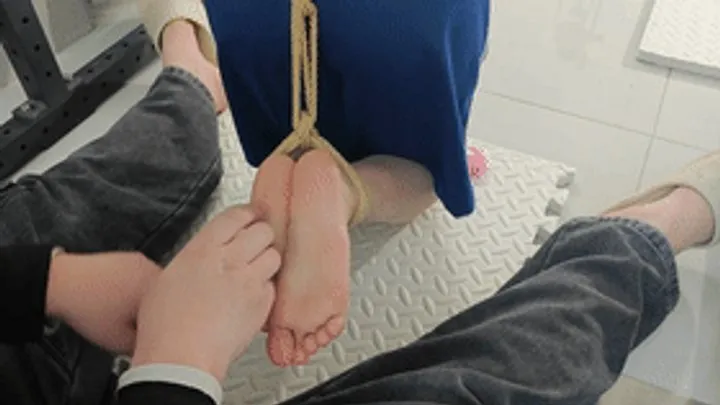 Chinese Bondage Foot Fetish - xy350 - Barefoot girl with her neck and hands bound by metal, her feet suspended and tickled.