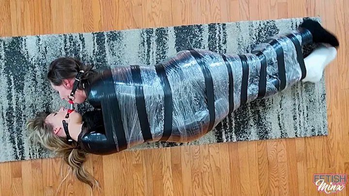 Minx Grrl's Fetish Corner - Cara and Minx - Friends Wrapped, Wriggling and Double Ball Gagged (MP4 Format)
