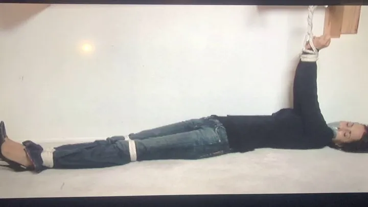 Fm Concepts 1080p Bondage Store - Tape-gagged brunette Gia Mancini lay stretched out and writhing on the floor with her arms tied overhead to a wooden bar!