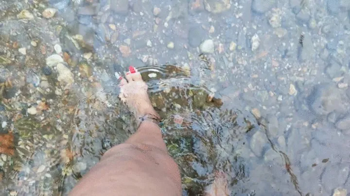 Goddess Foot Fetish - Walking barefoot through a river with many stones (1)