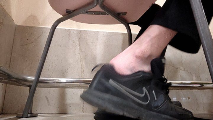Salvatrix Crucifix - Shoeplay sockless sitting at the restaurant