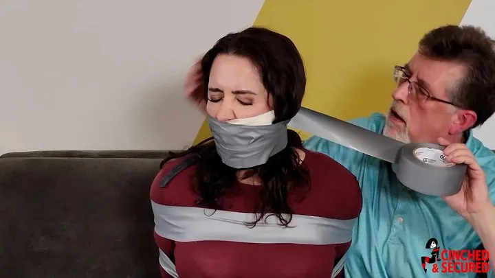 Cinched And Secured - Tilly McReese - Tight Hogtape With Multi Layered Gag Stops Her Complaints (WMV Format)