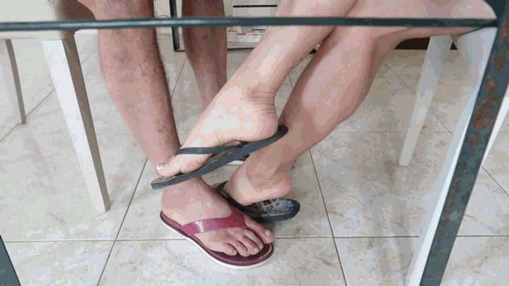 Princess Of Volcanoes - Two people in flip-flops at a table AVI