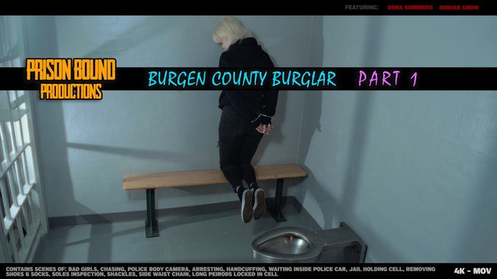 Prison Bound Productions - The Bergen County Burglar - Kora Summers is a rebellious bad girl with high stakes kleptomania. Break and enter thief gets caught, arrested, taken to jail, shoes taken, left barefoot in a holding cell, waist chain, cuffed and shackled. -4K -MOV